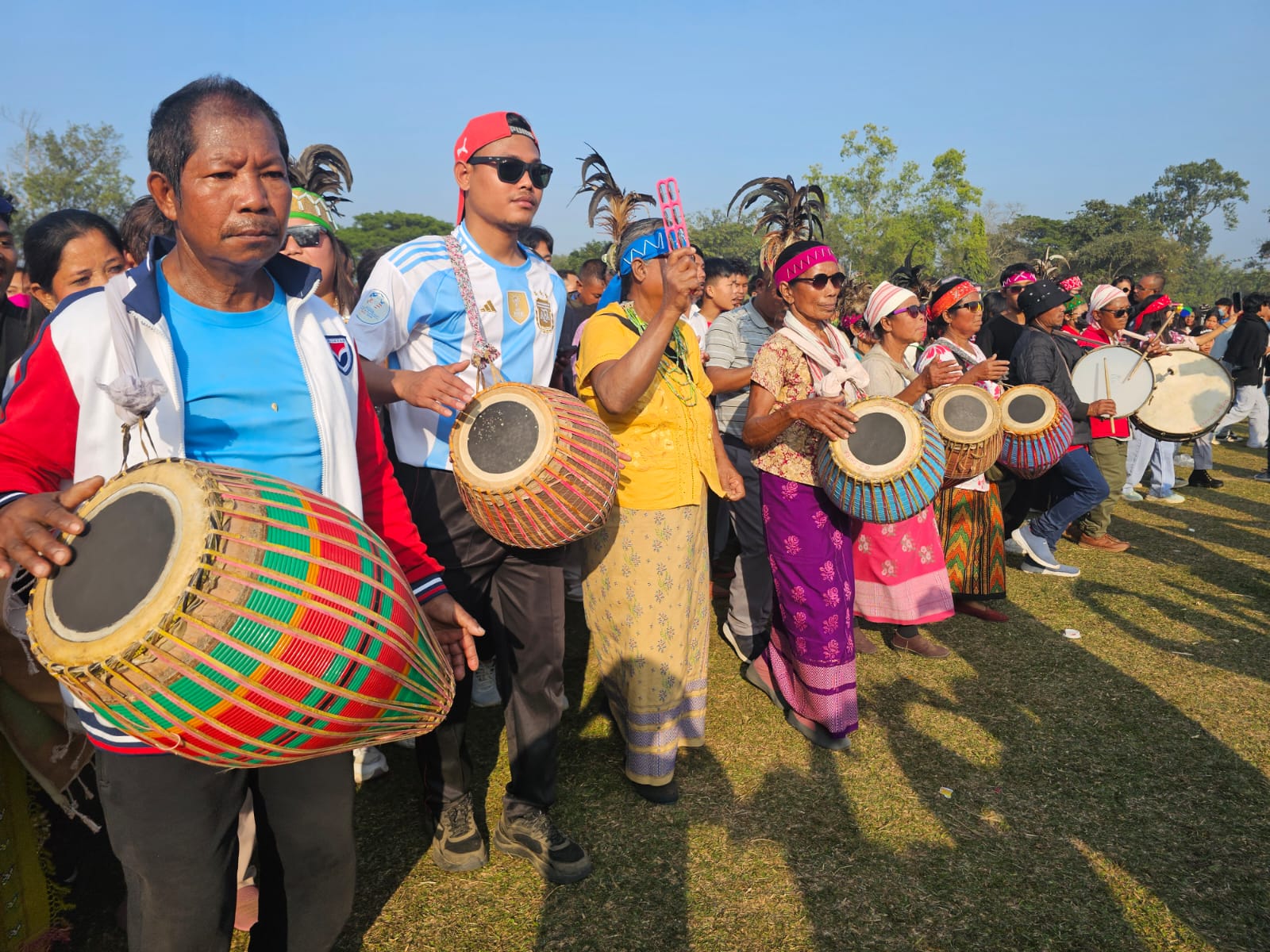 A massive celebration marked the Garo New Year 2026, bringing together thousands of people from across India and even international visitors to the Bangsi Apal playground in North Garo Hills. The festival showcased the rich cultural heritage of the Garo community and was especially notable for its vibrant drumming and traditional dances. The festivities began early in the morning around 9 AM, as the first beats of the drums echoed through the area, drawing crowds eager to join the celebration. Women, taking center stage, played powerful drum rhythms that energized the participants. Men, women, and young people danced together to the pulsating beats, creating a lively and colorful atmosphere. By noon, hundreds of thousands of people were seen dancing and celebrating in unison, marking one of the largest gatherings for the Garo New Year in recent years. The event not only highlighted the community’s artistic traditions but also reinforced unity, joy, and cultural pride among participants. Organizers said the festival aims to preserve tribal customs while providing a platform for cultural exchange, as many visitors from outside the region attended and participated. The 2026 celebration of the Garo New Year was hailed as a grand success, leaving lasting memories for all who attended.