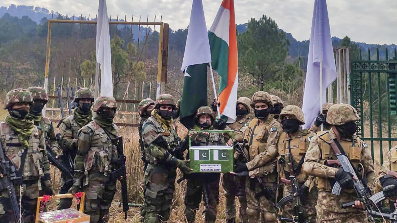 Indian Army exchange gifts with Pakistani troop